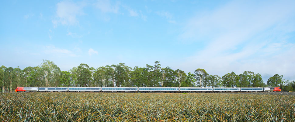 A​ colour photograph of the Cairns tilt train that commenced operations between Brisbane and Cairns in 2003. The photograph was taken near Landsborough, full image description is available below.