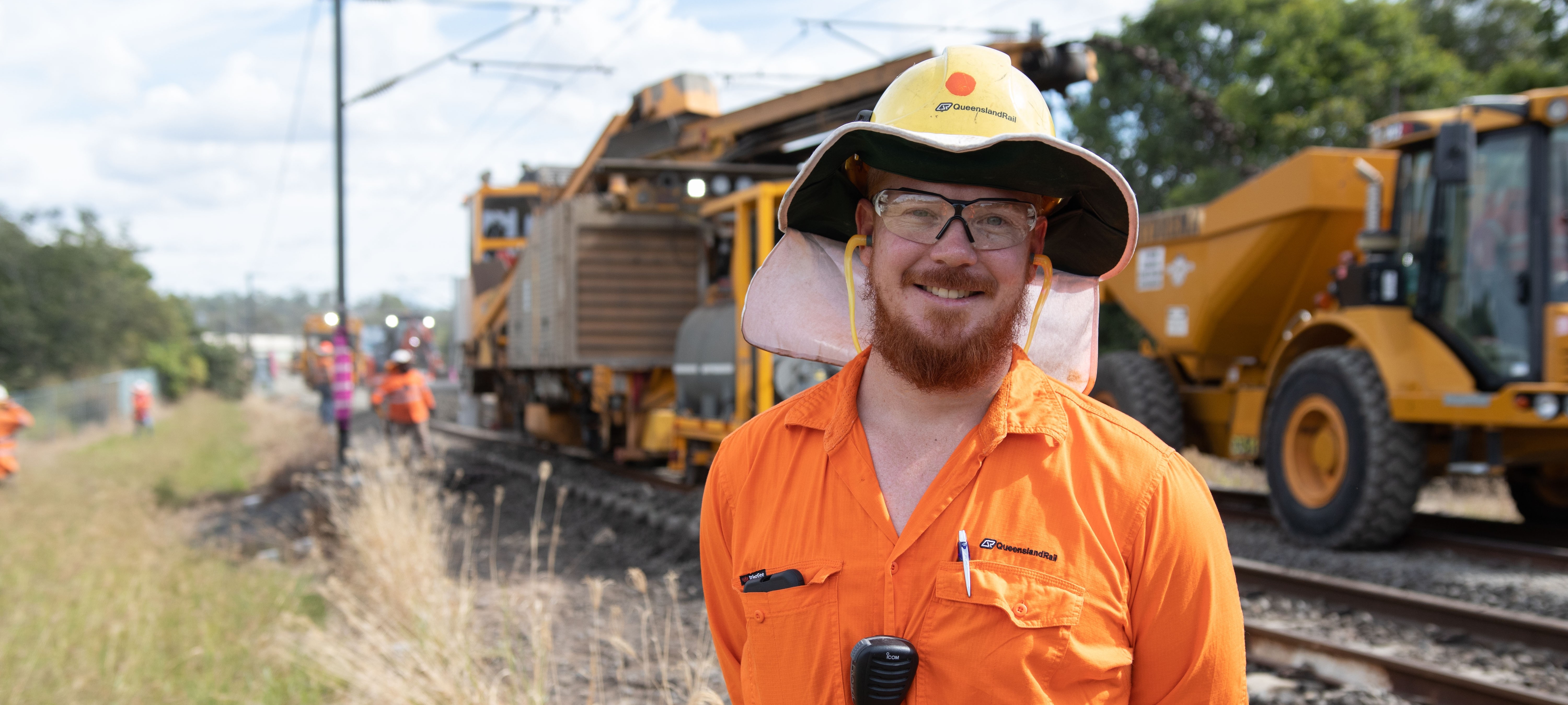Worker in front of the track