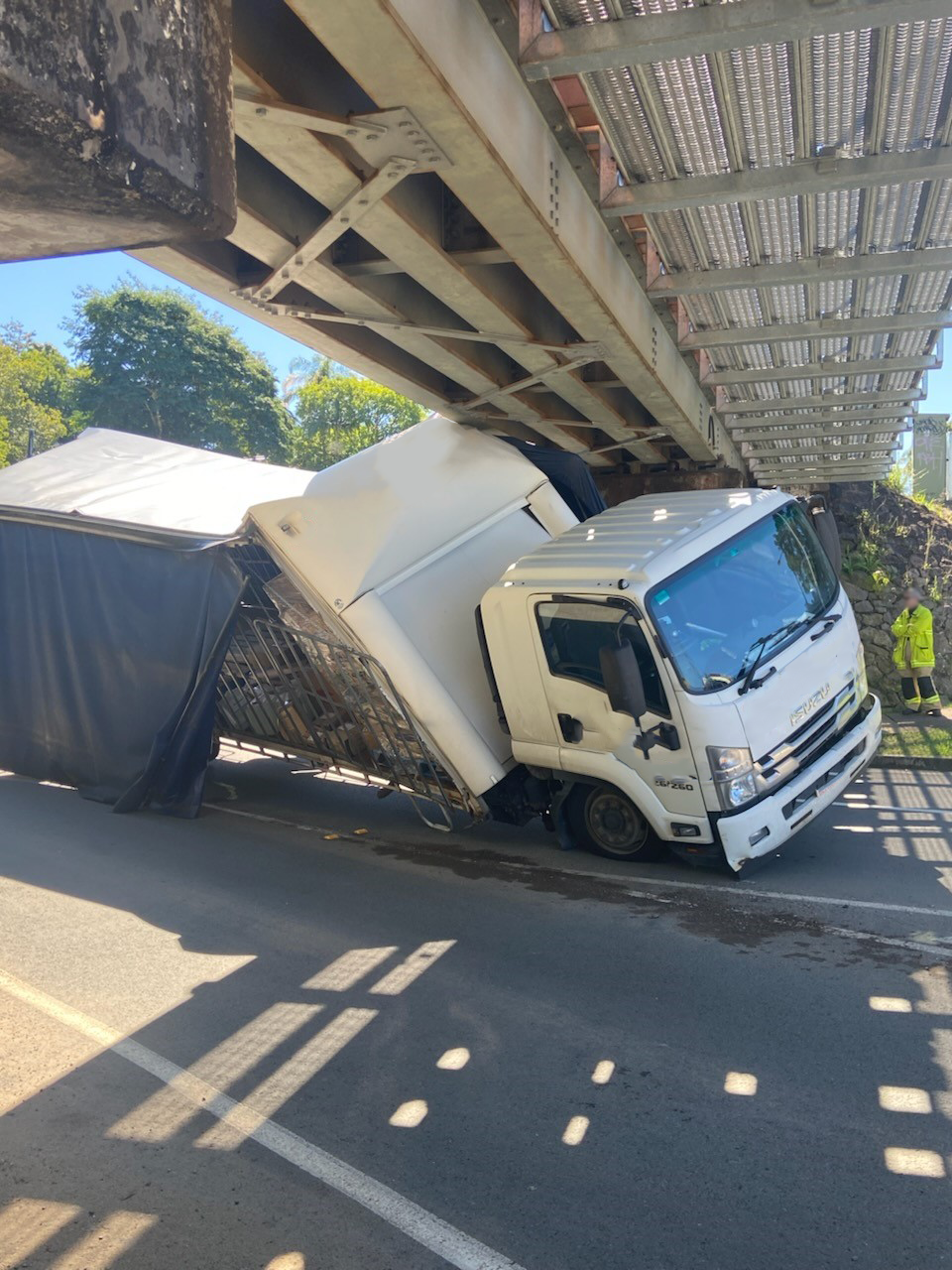 Truck wedged under a bridge at Nambour