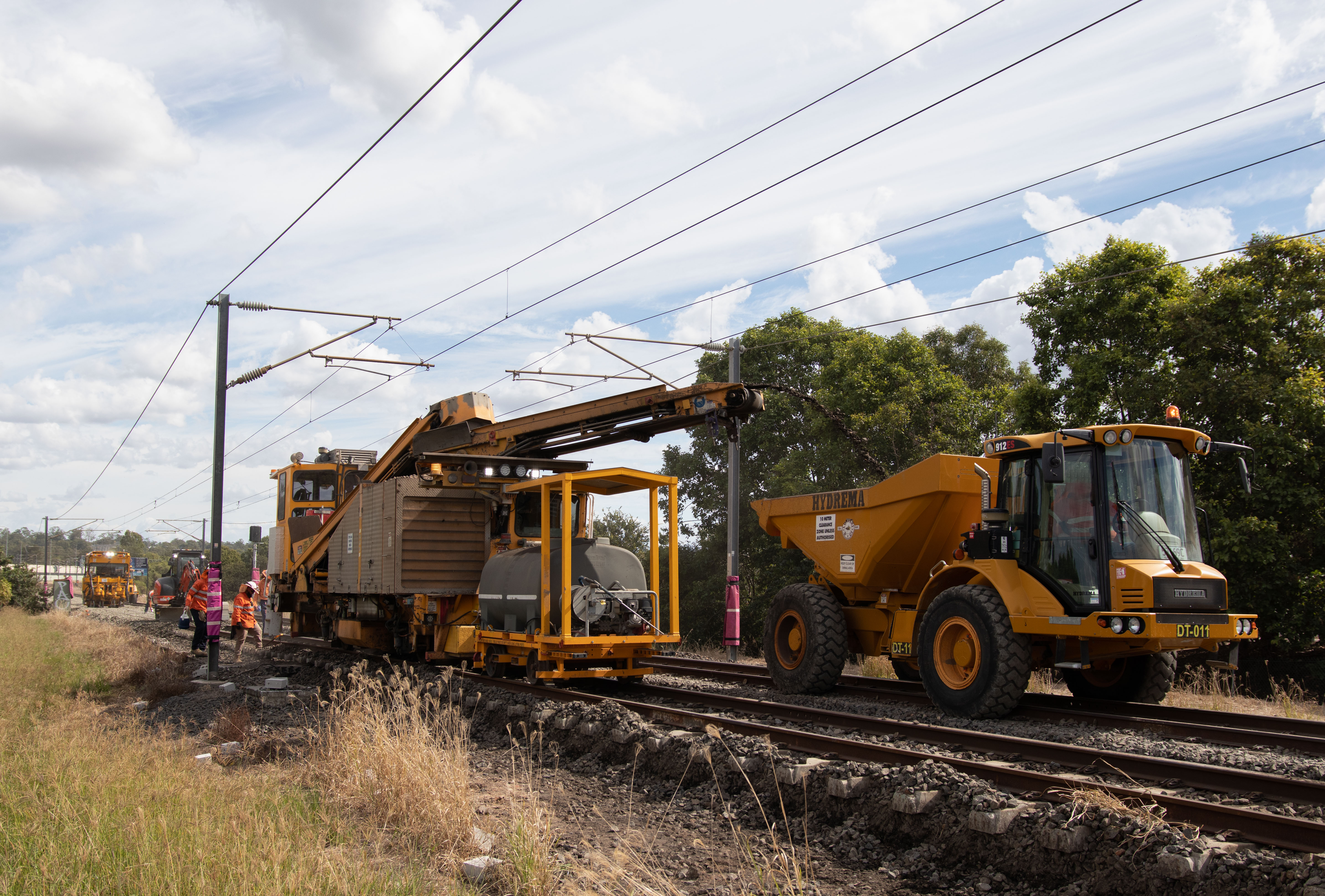 Queensland Rail trucks working on train tracks