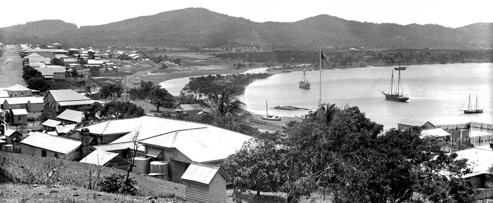 A black and white photograph of Cooktown harbour. The photograph would have been taken between the years 1899 to 1902, full image description is available below.