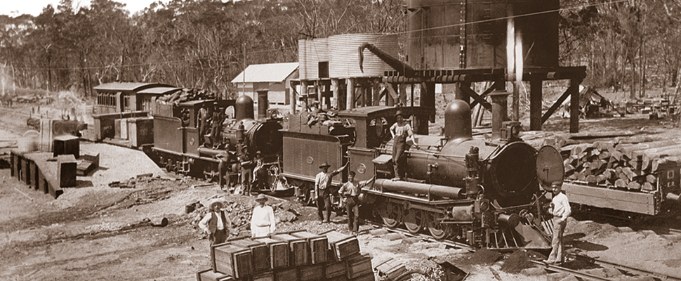 A sepia toned photograph showing construction work on the privately built, and operated Chillagoe Railway and Mining Company line, around the years 1907 to 1908,full image description is available below. 