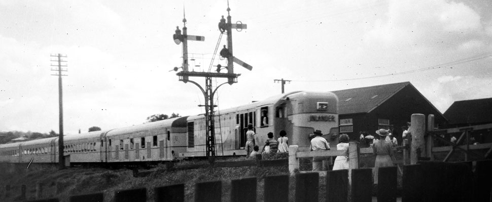 A black and white photograph of a 1150 class diesel train, these were the first mainline diesels purchased by Queensland Railways,full image description is available below.