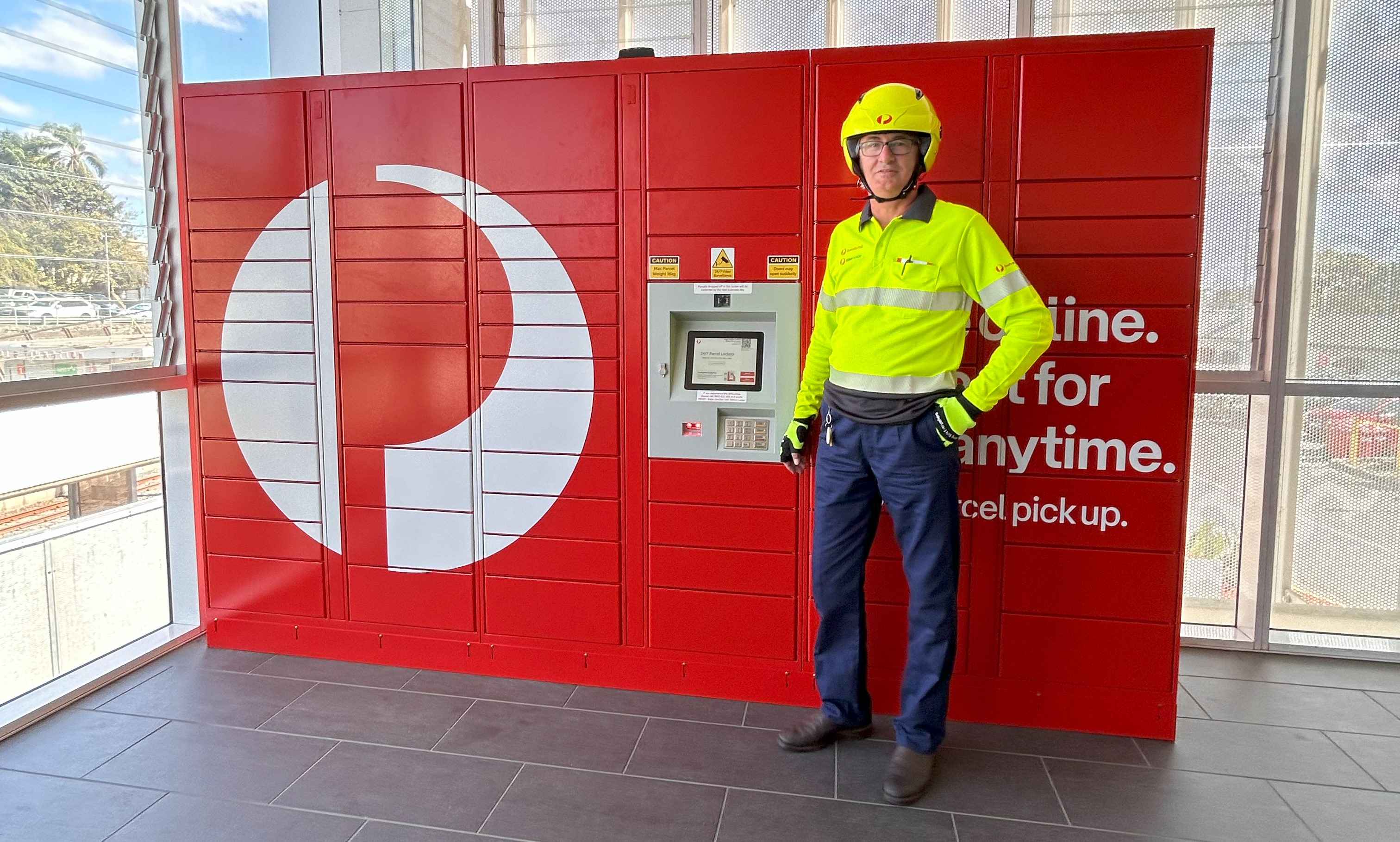 Australia post lockers and a postie